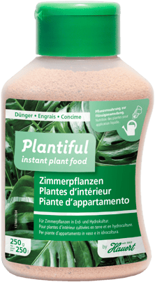Eine Flasche mit Dünger für alle Zimmerpflanzen