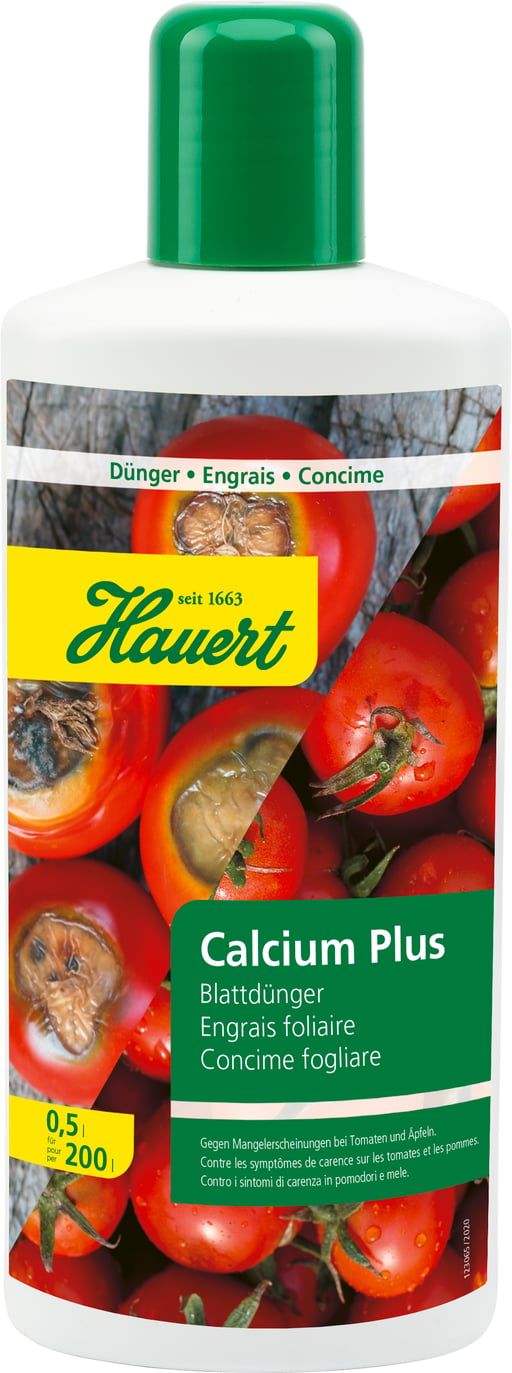 Eine Flasche mit Flüssigdünger für Tomaten, Äpfeln und Reben