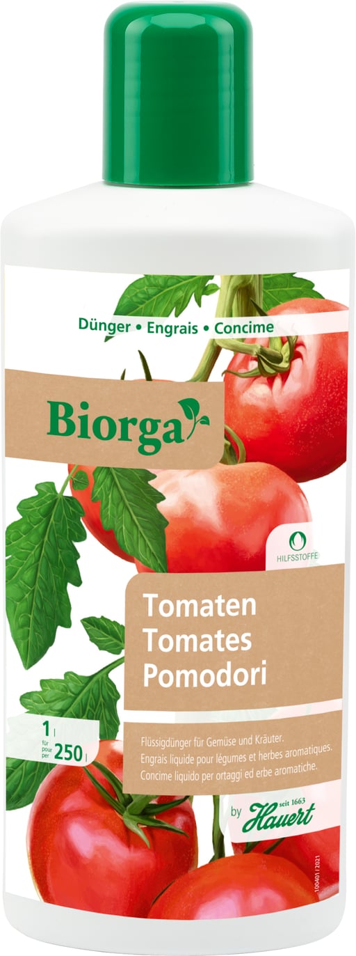 Eine Flasche mit Flüssigdünger für Tomaten